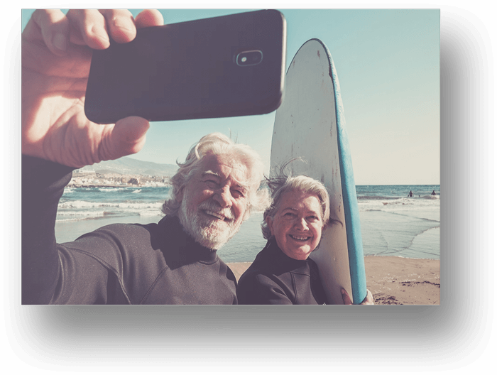 Older-Couple-Taking-Selfie-Surf-Board
